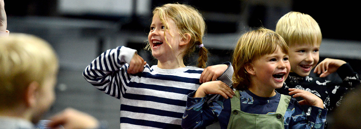 Toddlers enjoying a music and movement session on the Palace Theatre stage